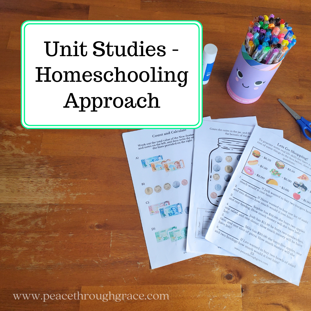 Unit Studies Homeschooling Approach - Featuring a printed out unit study on a wooden table with pens and scissors